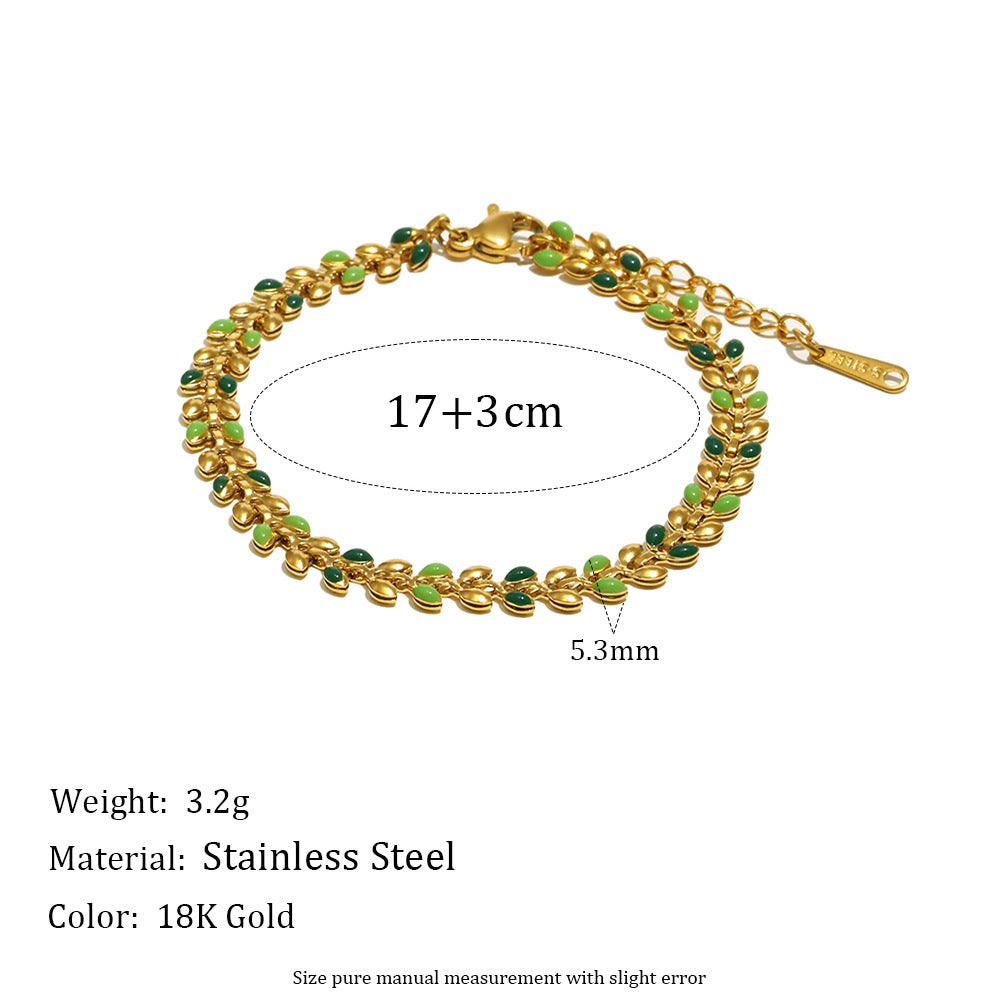 Pulsera minimalista de acero inoxidable con dije de margarita, detalles esmaltados y chapado en oro de 18 quilates para mujer