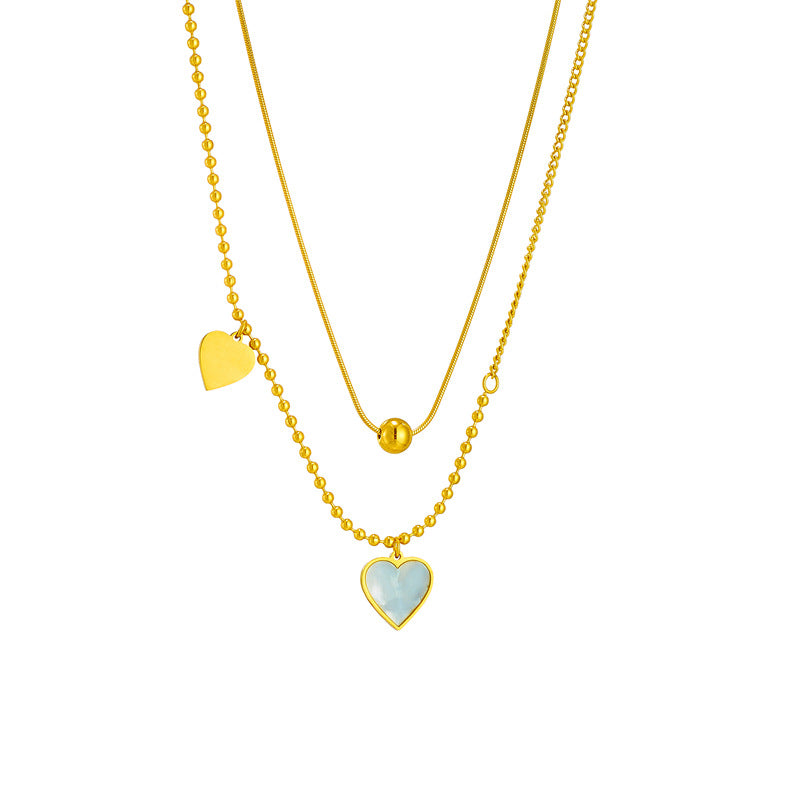 Collana pendente a cuore con conchiglia retrò francese minimalista in acciaio al titanio con finitura placcata per uno stile a strati