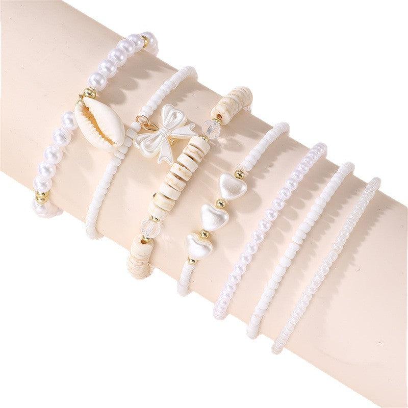 Braccialetto in stile bohémien minimalista con perle finte a forma di cuore e stella in argilla polimerica bianca per bambini