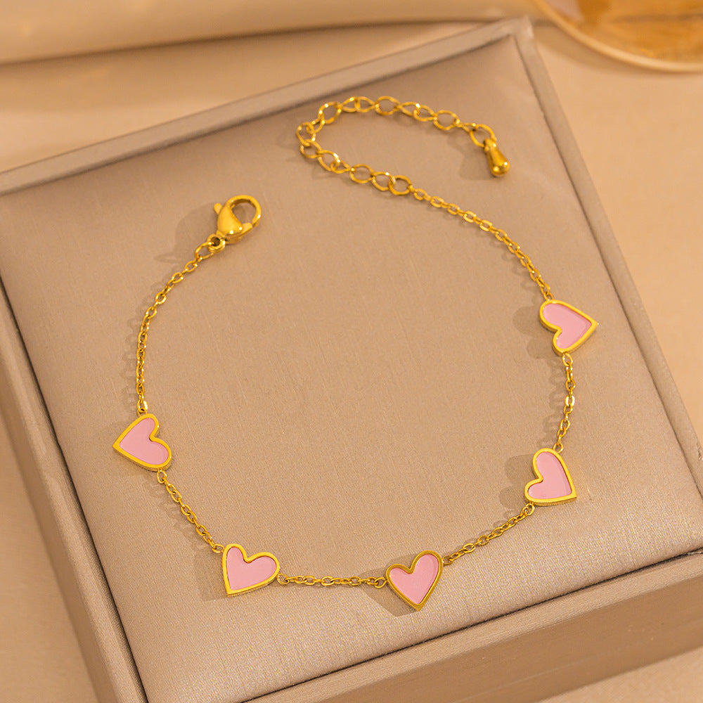 Pulsera minimalista de lujo ligero con forma de corazón de acero de titanio con PVD y oro blanco de 18 quilates y nácar para mujer