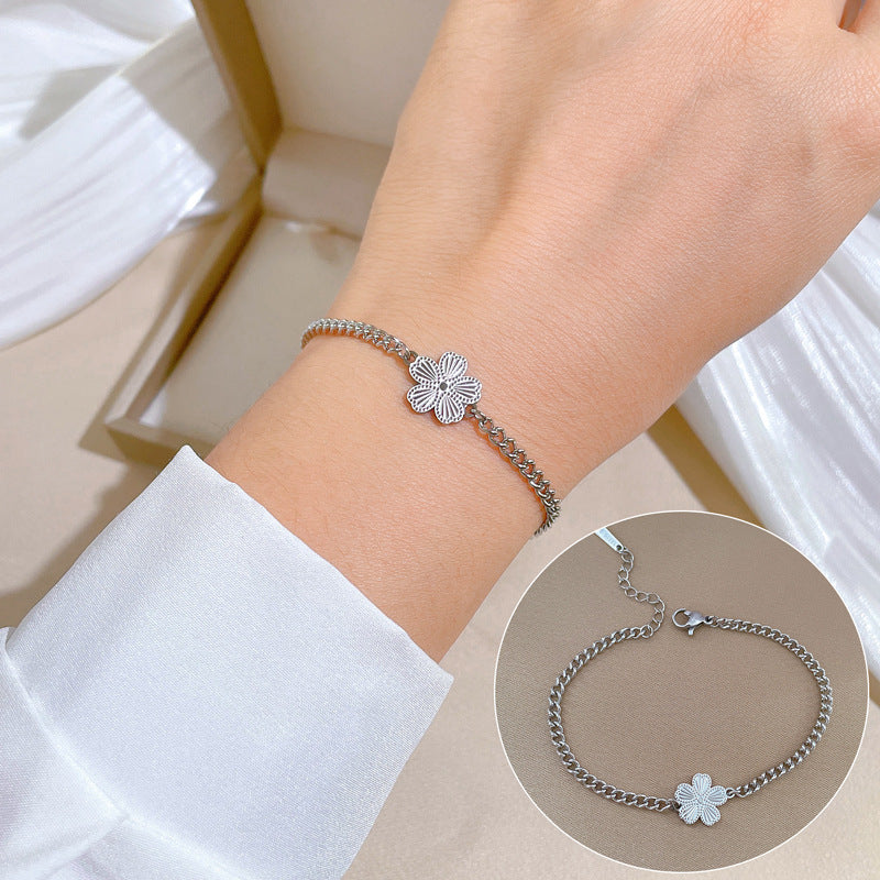 Minimalist Titanium Steel Five-Petal Flower Hand Chain for Women with Gold Plating and Wavy Texture Design