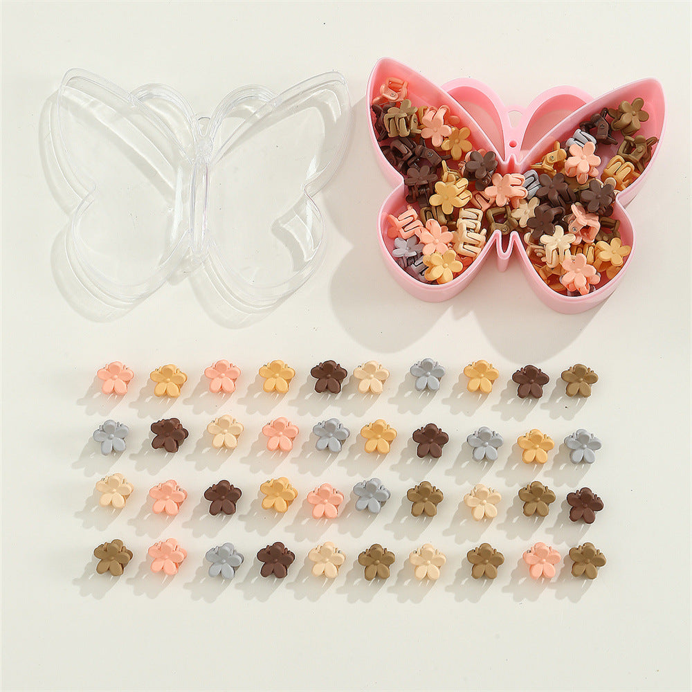 Fermaglio per capelli in plastica a forma di fiore per bambini con finitura smaltata in colori caramella