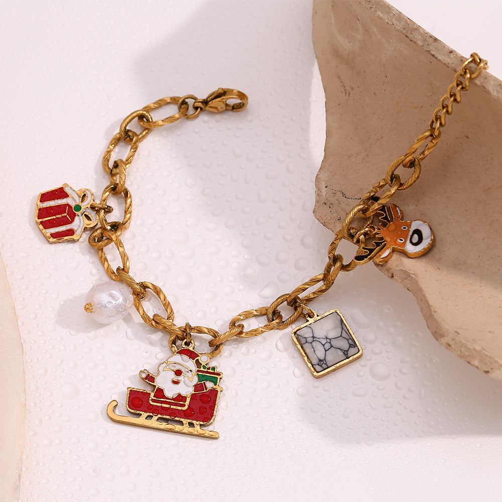 Simpatico bracciale da donna in acciaio inossidabile placcato oro 18 carati con Babbo Natale e renne in stile cartone animato
