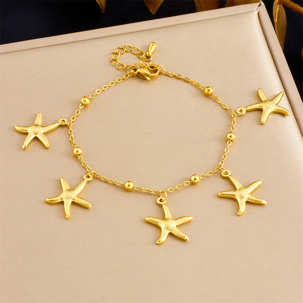 Tropical Ocean Style Gold Plated Stainless Steel Bracelet with Starfish and Tropical Fish Charms for Women