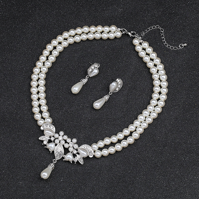 Set di collana e orecchini floreali ispirati a Chanel per donna con lega placcata oro, catena di perline e motivi botanici tra cui grano, petali, foglie e silhouette di alberi