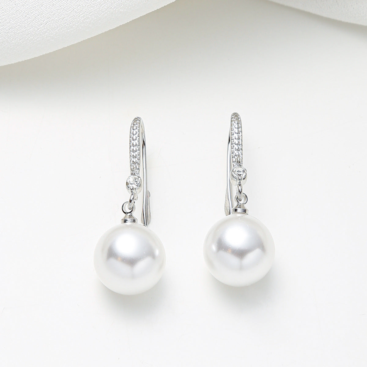 Minimalist Teardrop-Shaped Pearl and Zirconia Inlay Stud Earrings in Copper with Elegant Sophisticated Design