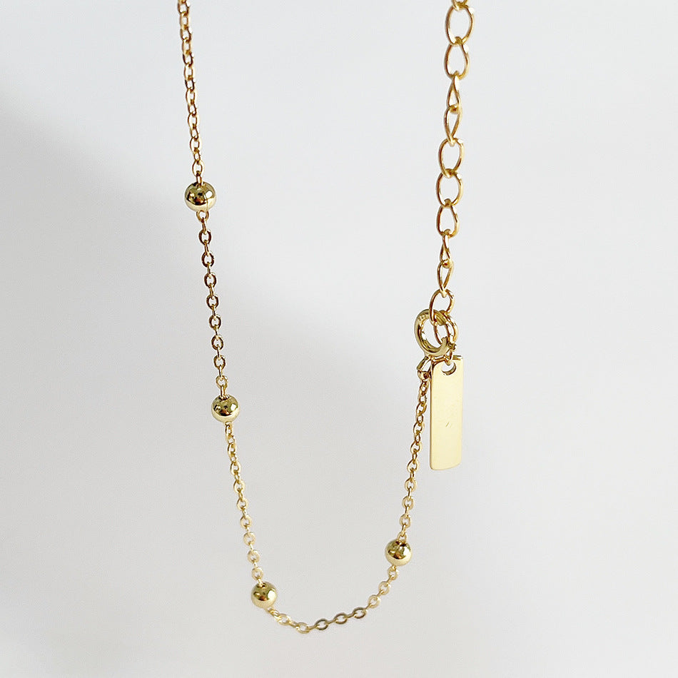 Deliziosa collana in argento sterling 925 placcato oro con dettagli a pois e a righe