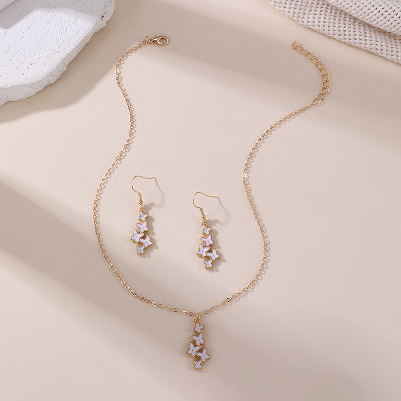 Conjunto de collar con colgante de lazo y mariposa minimalista con acabado esmaltado para niños, joyas de resina en cadena de cuentas
