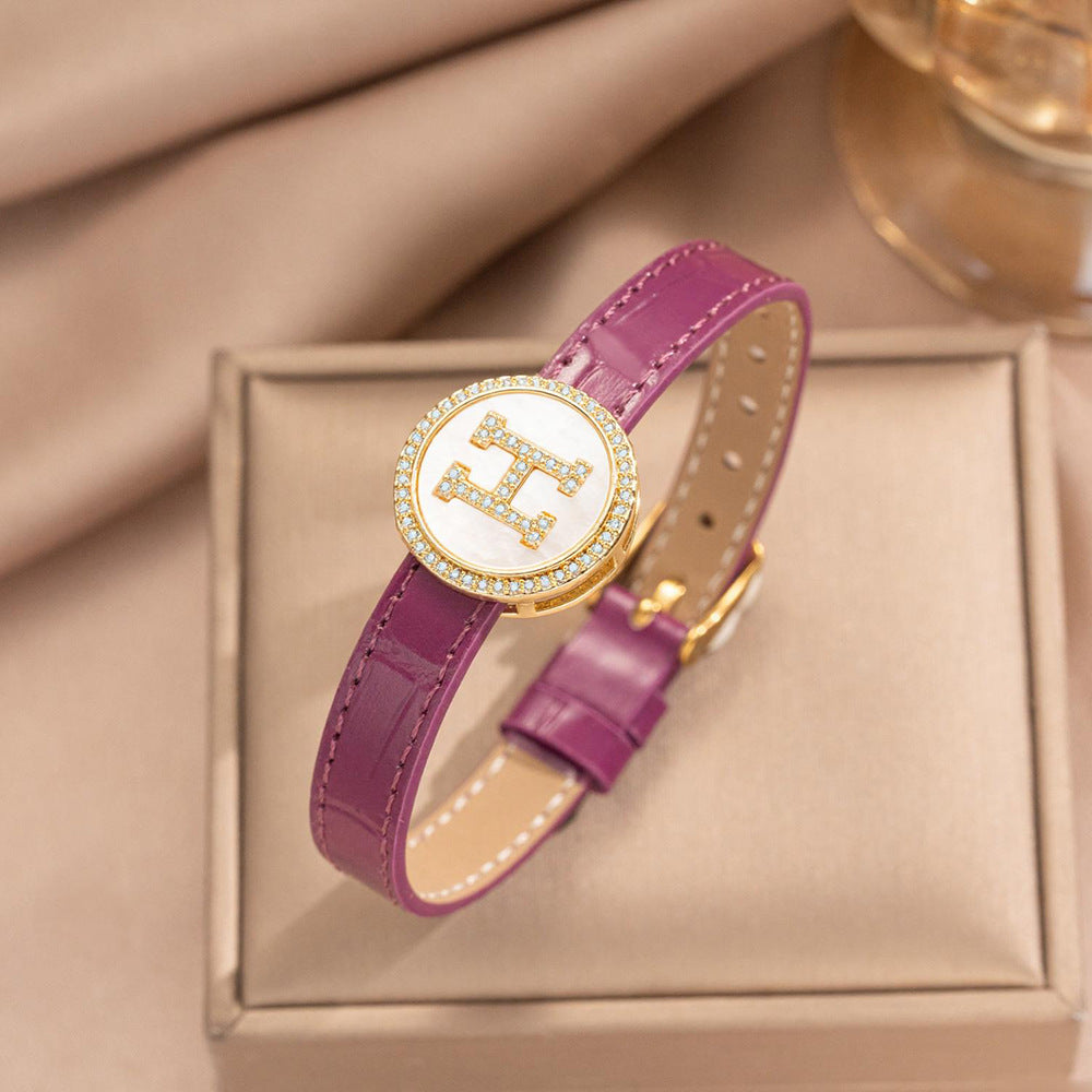 Pulsera de puño redonda chapada en oro de acero inoxidable minimalista con correa de cuero genuino para hombres y mujeres