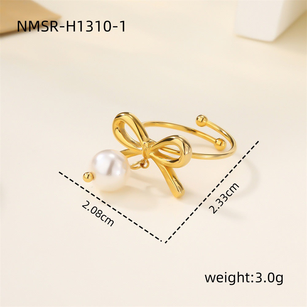 Elegante conjunto de pendientes y anillo de acero de titanio con forma de corazón y motivo de estrella de mar, galvanizado para un aspecto premium resistente a la decoloración