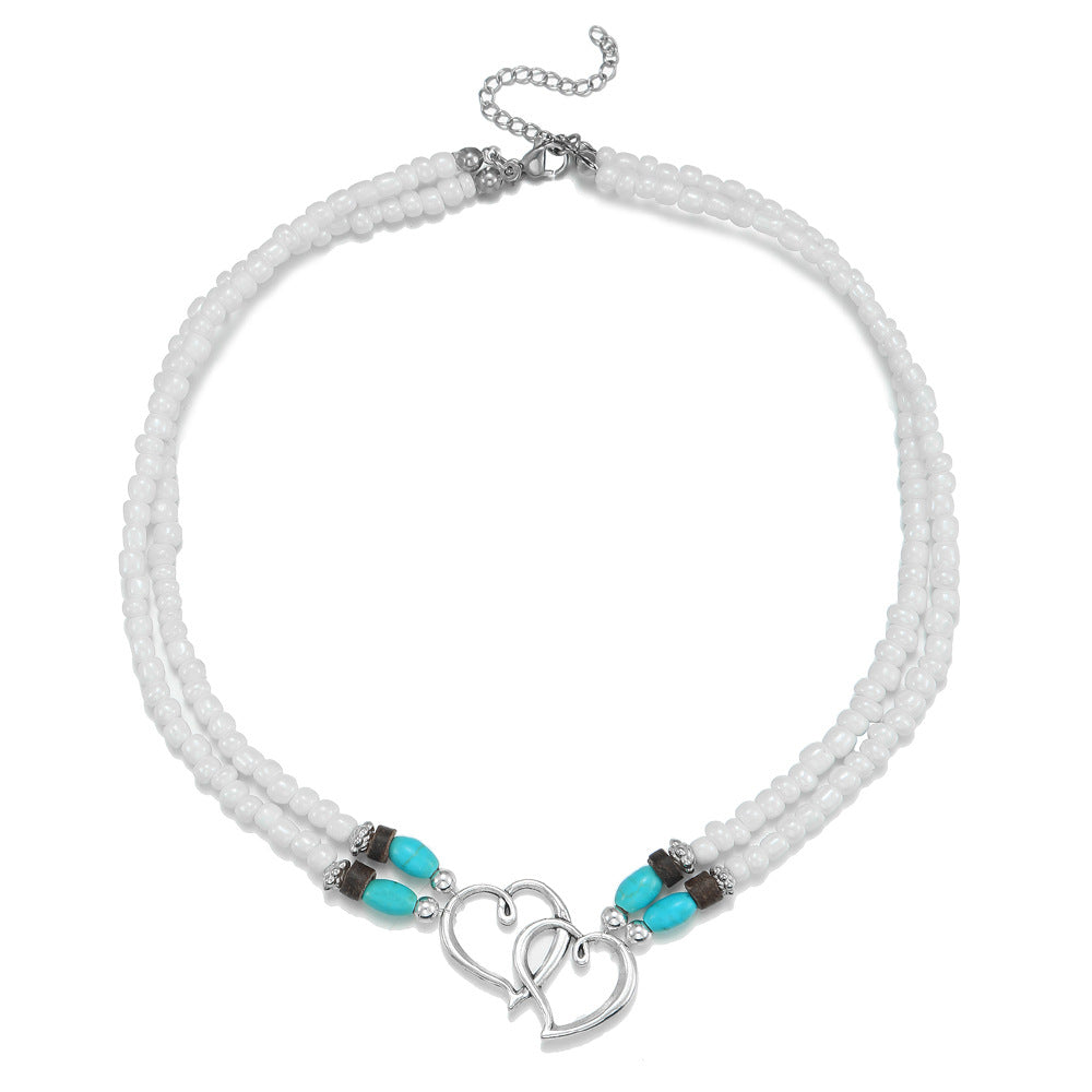 Collana da donna fatta a mano a doppio strato a forma di cuore in lega con perline turchesi su catena a O