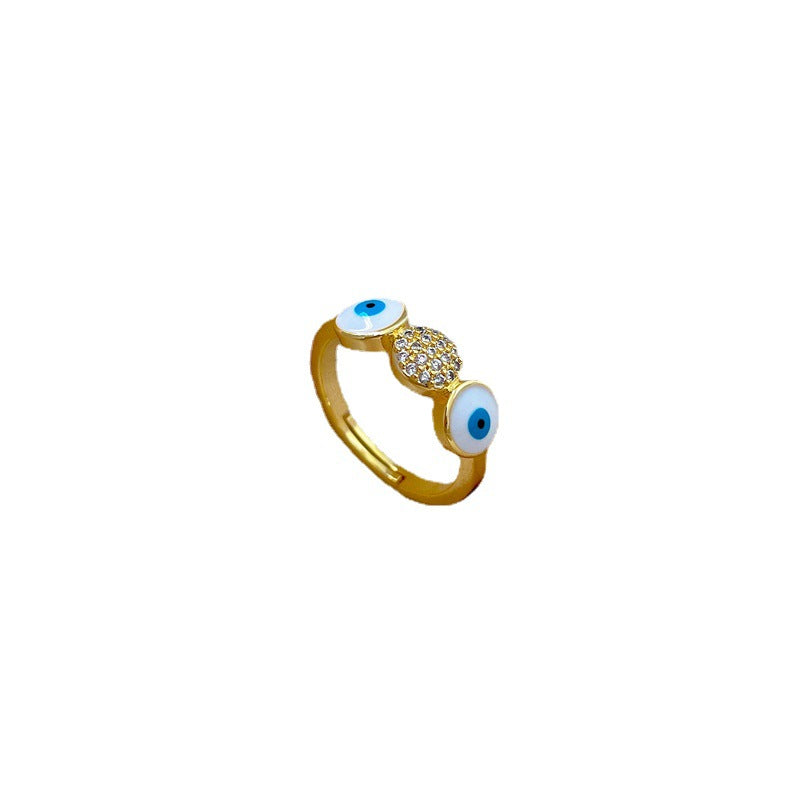 Anello da donna in ottone placcato oro con zirconi micro-incastonati a forma di occhio minimalista