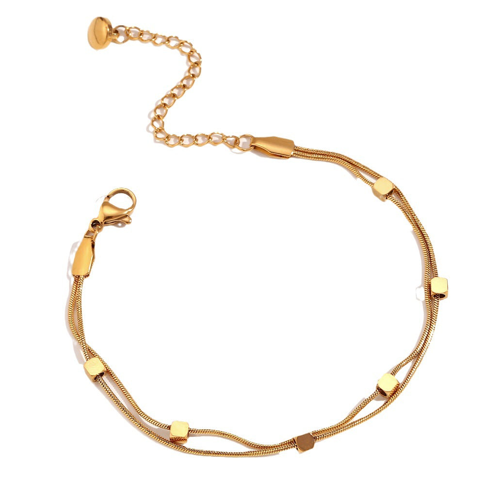 Tobillera minimalista geométrica de acero inoxidable con cuentas cúbicas bañadas en oro de 18 quilates y doble cadena de serpiente para mujer