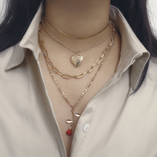 Collana pendente geometrica a rosa creativa per donna in lega con catena incrociata, motivo floreale e finitura placcata
