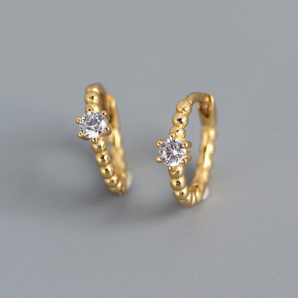 Orecchini a perno tondi con intarsi di diamanti in argento sterling 925
