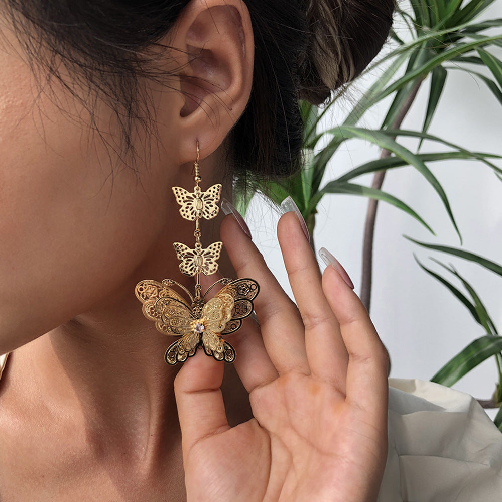 Pendientes de mariposa de aleación chapada, pendientes colgantes largos de moda para mujer, diseño geométrico estilo dulce y moderno
