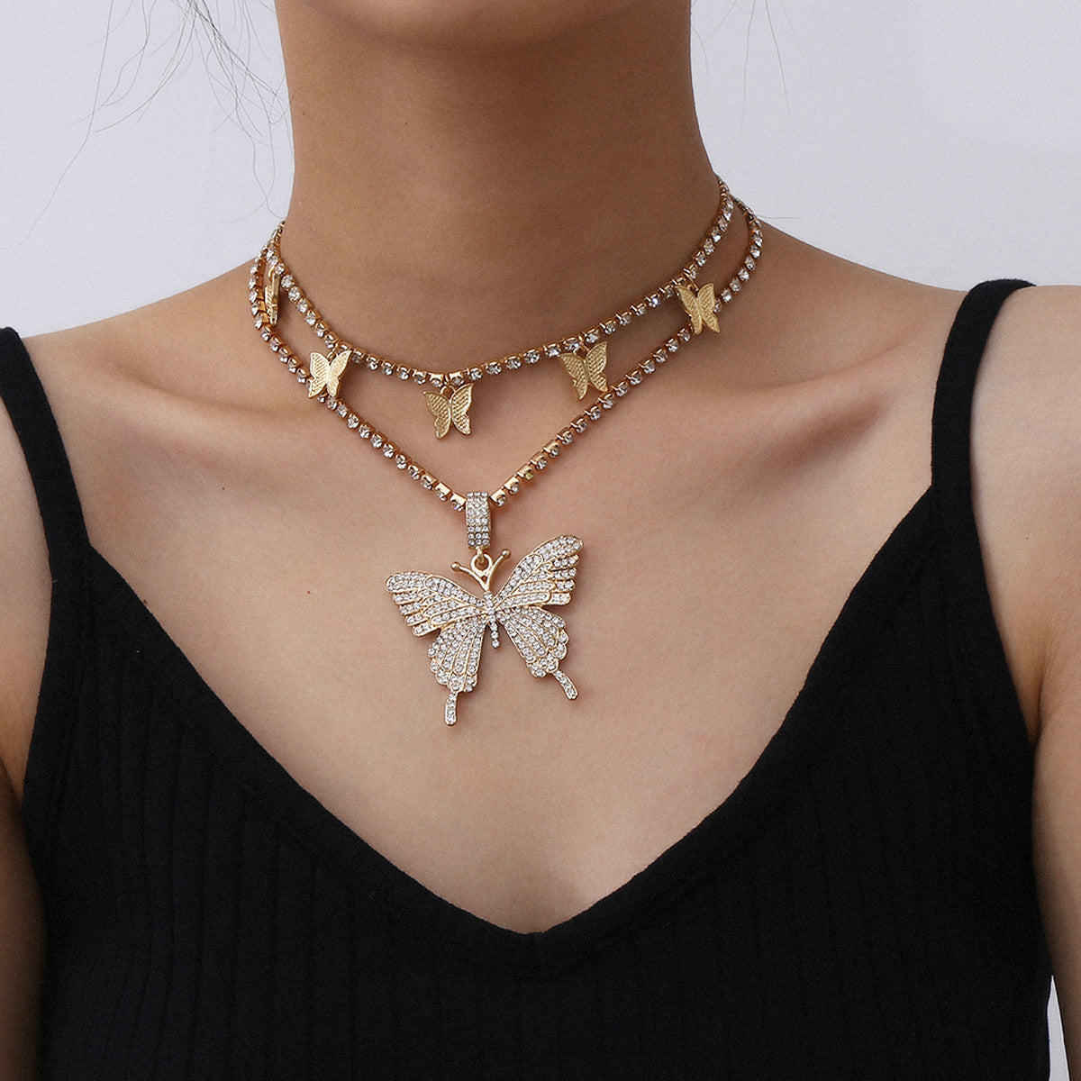 Parure collana geometrica a farfalla con strass e lega per donna, design placcato con catena a griffe, stile individualista, gioielli alla moda