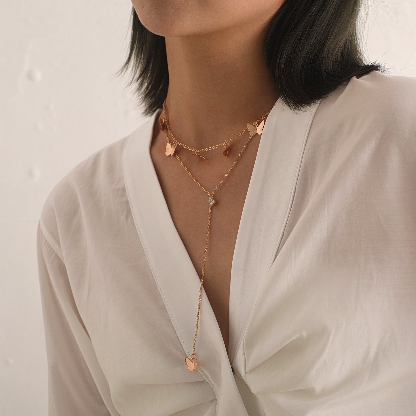 Women's Fashion Double-Layer Alloy Butterfly Pendant Necklace with Rhinestone Drop, Cross Chain Style, Vintage Aesthetic