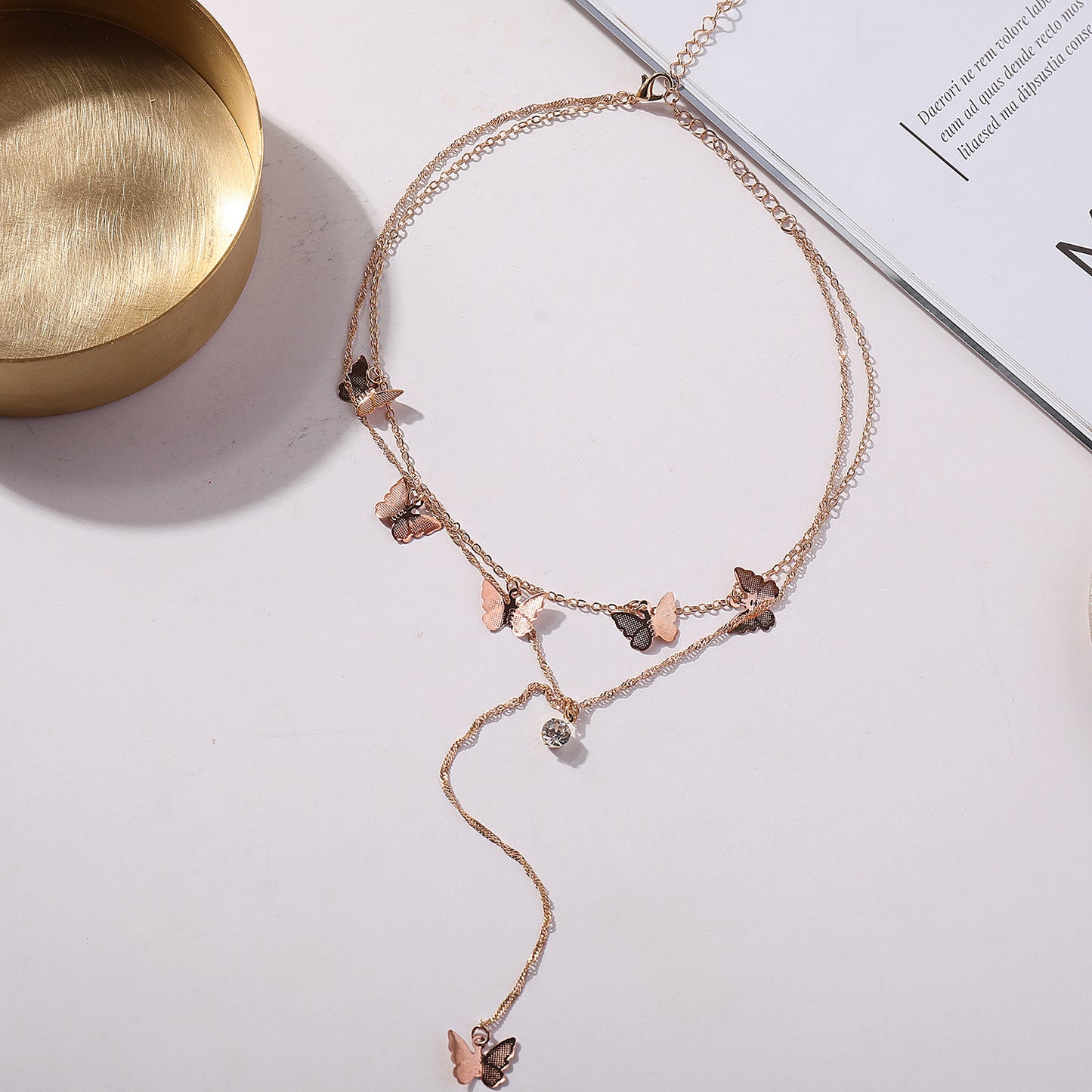Women's Fashion Double-Layer Alloy Butterfly Pendant Necklace with Rhinestone Drop, Cross Chain Style, Vintage Aesthetic