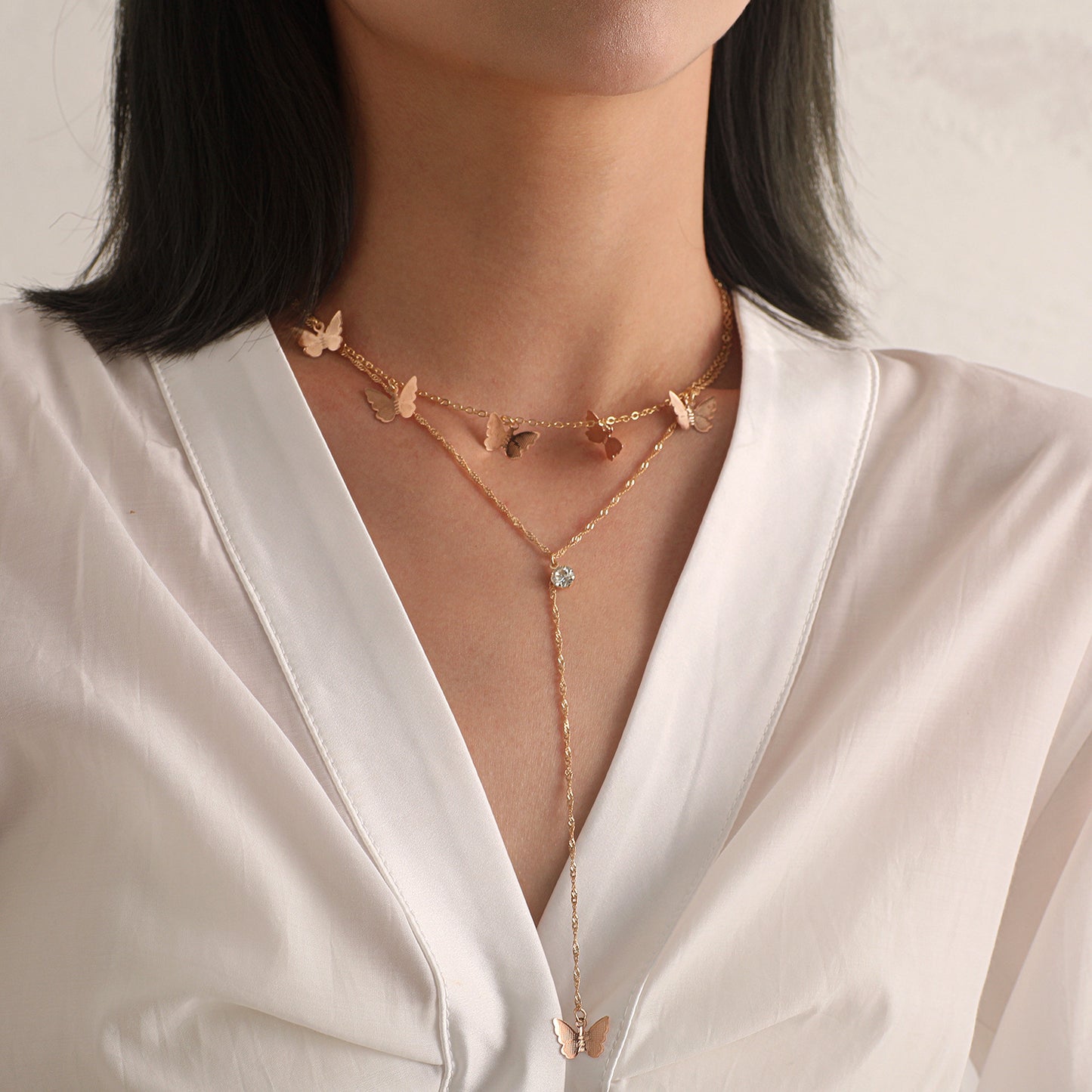 Women's Fashion Double-Layer Alloy Butterfly Pendant Necklace with Rhinestone Drop, Cross Chain Style, Vintage Aesthetic