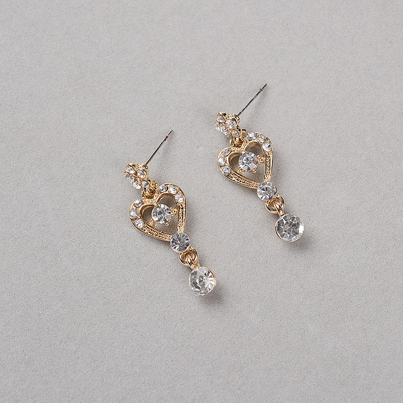 Set di collana con ciondolo a corona in lega intarsiata con strass dolci e orecchini con catena a sfera da donna