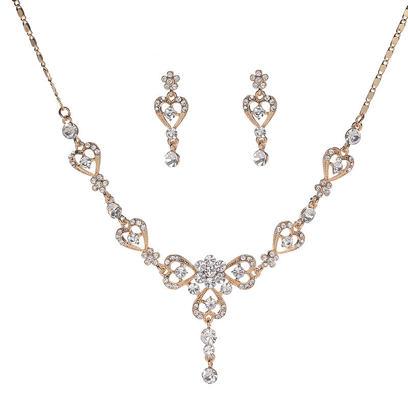 Set di collana con ciondolo a corona in lega intarsiata con strass dolci e orecchini con catena a sfera da donna