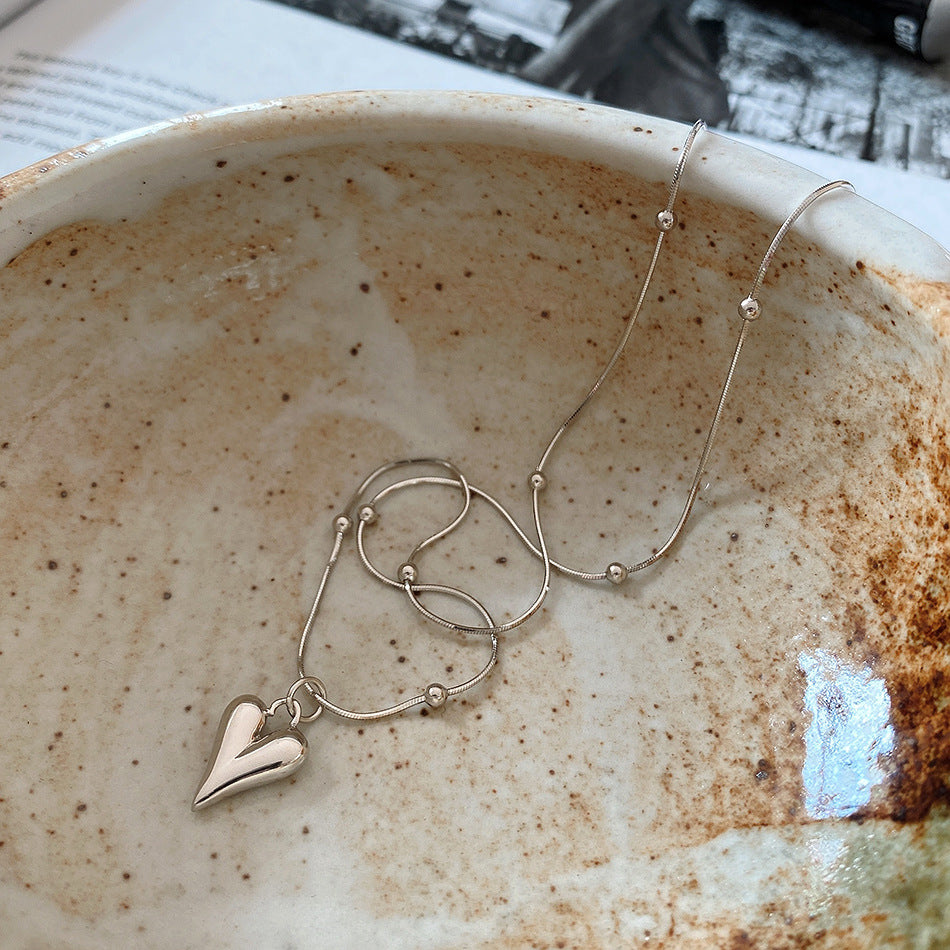 Collana da donna minimalista con ciondolo geometrico a cuore tondo in argento sterling 925