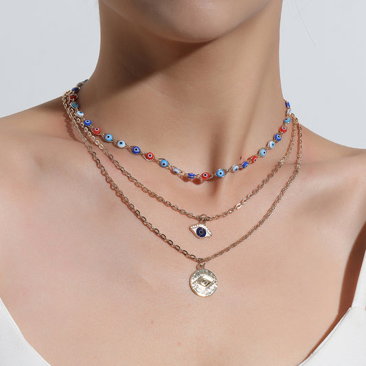 Collar con colgante de ojo de aleación estilo europeo para mujer, joya de moda llamativa con cadena cruzada multicapa, diseño de ojo de tendencia