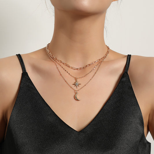 Collana da donna di lusso con pendente a stella minimalista e intarsi di strass, catena a croce in lega, design multistrato
