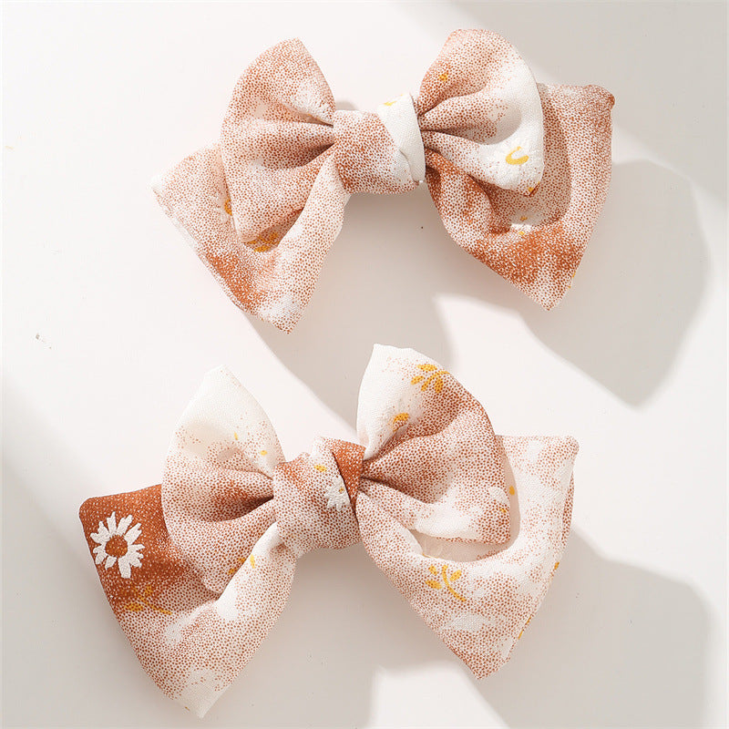 Set de pinzas para el cabello florales pastel dulces para niñas con diseño de tela en forma de moño en estilo ligero de lujo