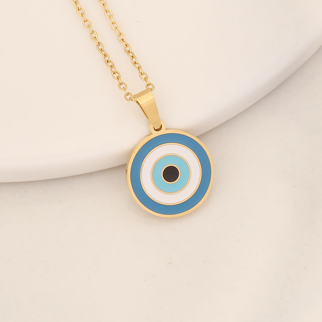 Collana con pendente a forma di occhio in acciaio inossidabile audace con finitura a olio a goccia