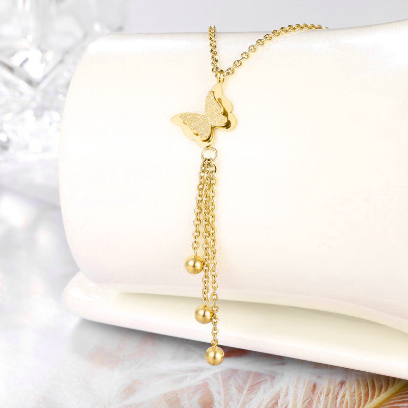 Collar con colgante de mariposa minimalista de acero de titanio con baño de oro para mujer