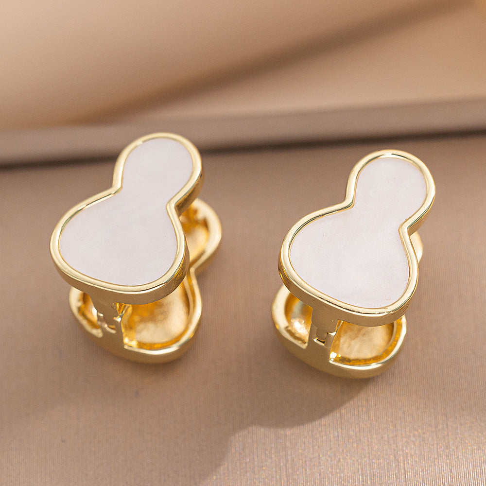 Orecchini a perno Saturno minimalisti color oro in ottone con zirconi per donna