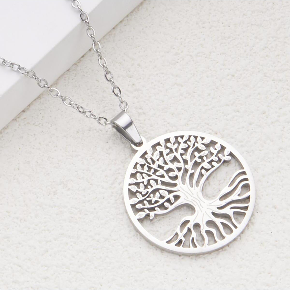 Minimalist Hollow Tree of Life Pendant Necklace for Women and Men in Stainless Steel with Titanium Steel Charm and Plated Finish