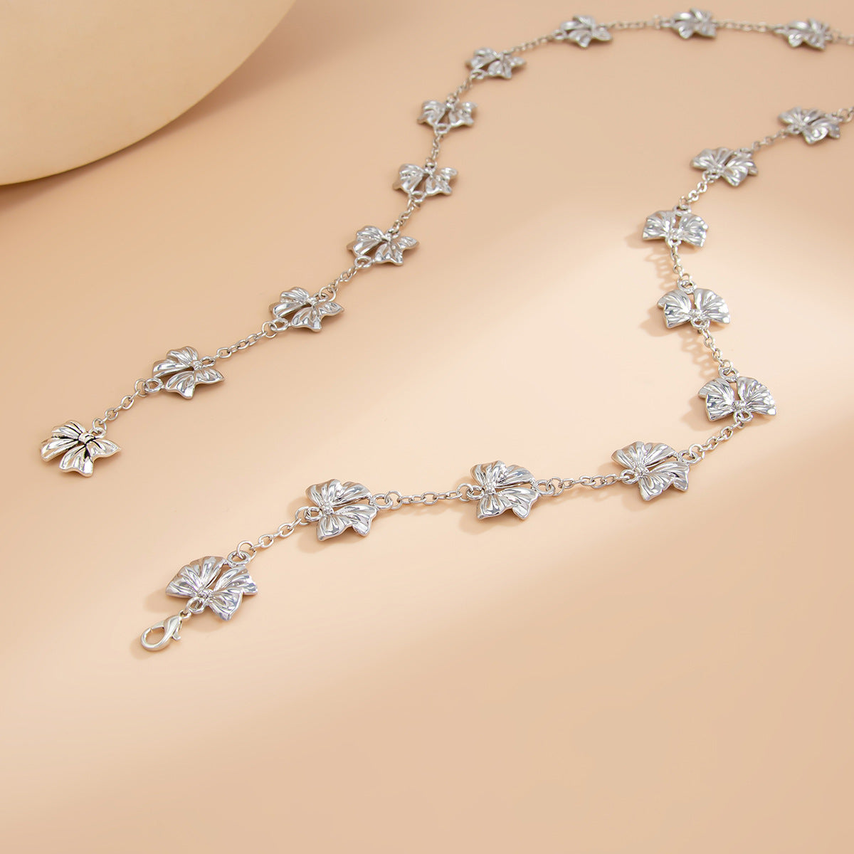 Minimalist Bow-Shaped Alloy Pendant Necklace with Y-Shape Design and Tassel Accents for Women