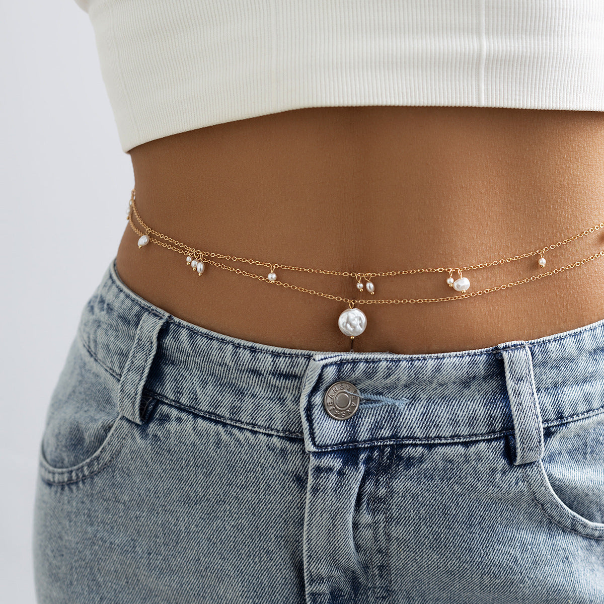 Cadena corporal metálica minimalista inspirada en la playa con detalles de borlas para mujer