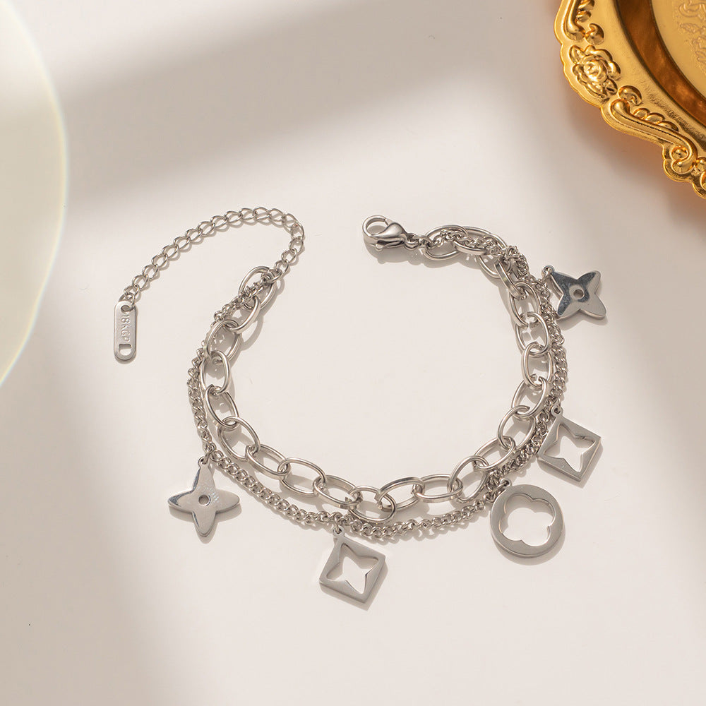 Bracciale da donna in acciaio inossidabile a forma di trifoglio, placcato in oro rosa 18 carati e con design traforato