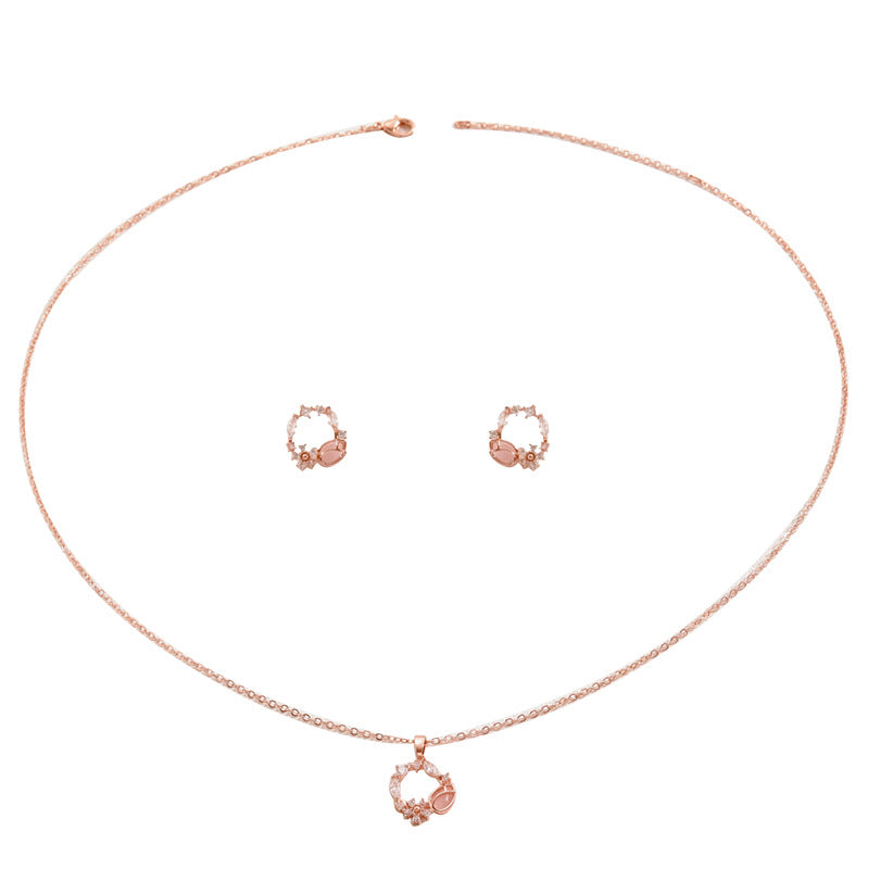 Set di collana e orecchini pendenti floreali minimalisti in rame con intarsio di zirconi da donna