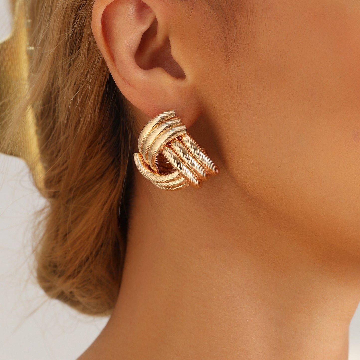 Vintage Geometric Metal Stud Earrings with Hollow Interwoven Design and Electroplated Finish