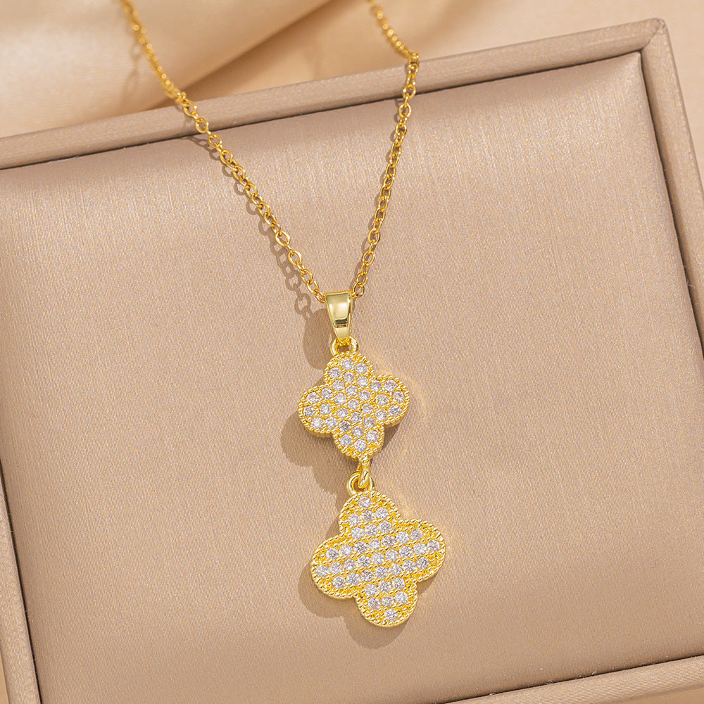 Collana da donna con ciondolo a trifoglio geometrico alla moda in zircone, placcato oro 18K su acciaio inossidabile, con catena a maglie.