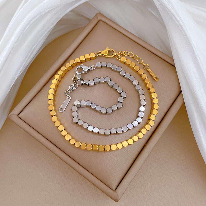 Bracciale Minimalista da Donna a Catena Box in Acciaio al Titanio Tonalità Fredde con Design Zodiacale e Intarsio in Oro