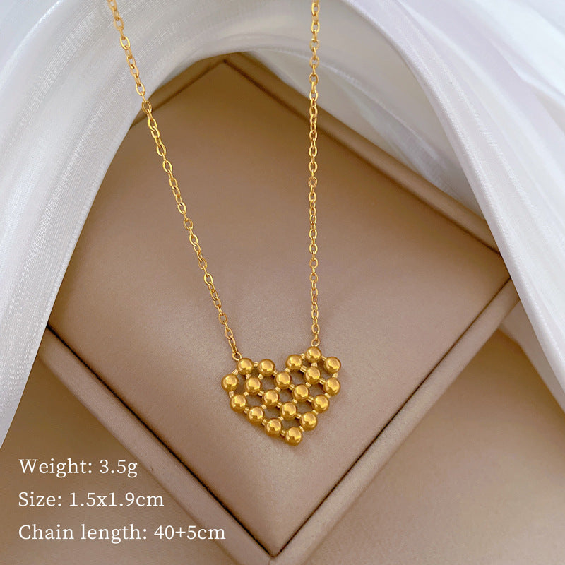Minimalist Titanium Steel Hollow-Out Round Bead Heart Pendant Necklace for Women with Gold Plating and Geometric Design for Clavicle Styling