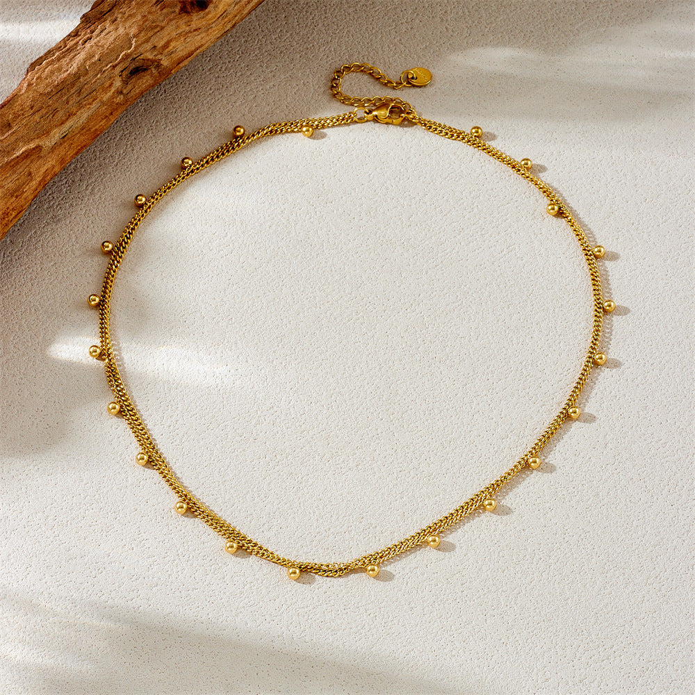 Collana da donna a doppio strato con perline rotonde in acciaio inossidabile placcato oro, stile minimalista