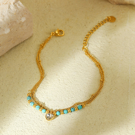 Elegante Pulsera de Cuentas de Piedra Natural Azul en Forma de Corazón con Incrustaciones de Circones sobre Cadena de Acero de Titanio para Mujer