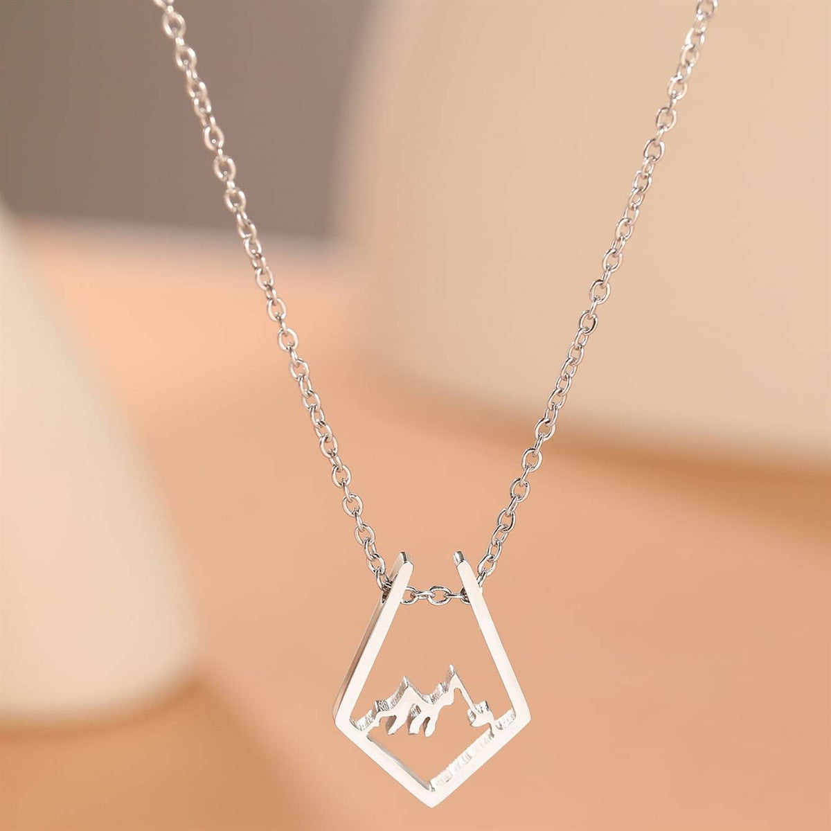 Natural Style Geometric Hollow Mountain Silhouette Pendant Necklace in Titanium Steel with Plated Finish on Pearl Chain for Everyday Wear and Holiday Gifting