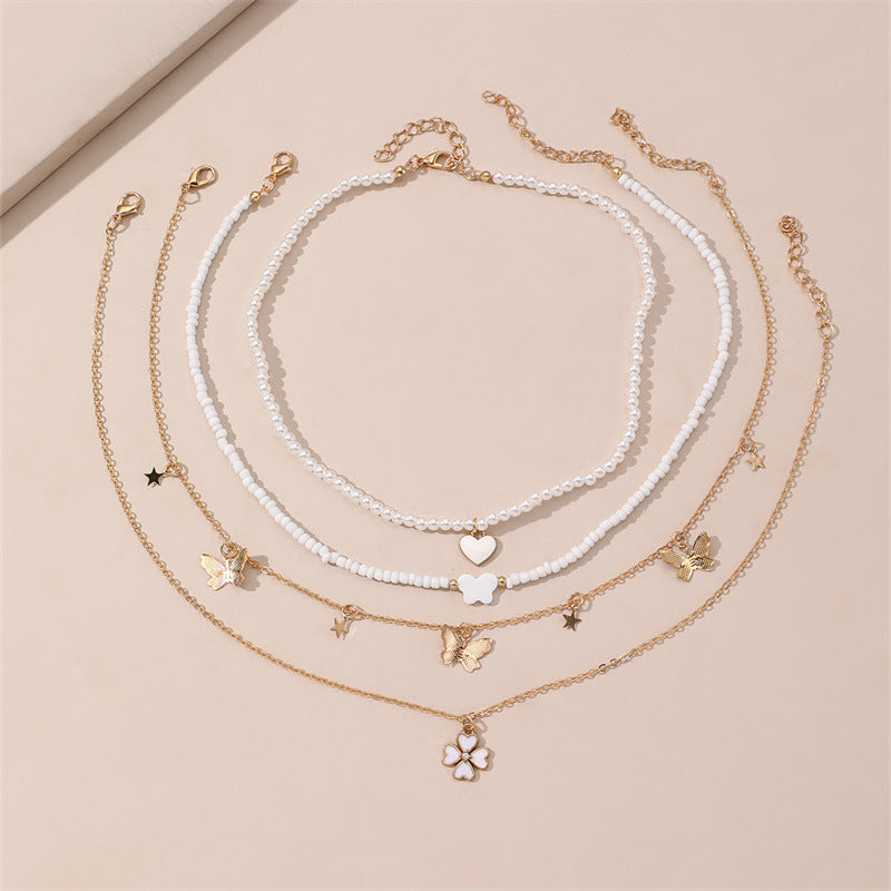 Bonito collar con dije de aleación esmaltado en forma de corazón para niños con cadena de eslabones torcidos