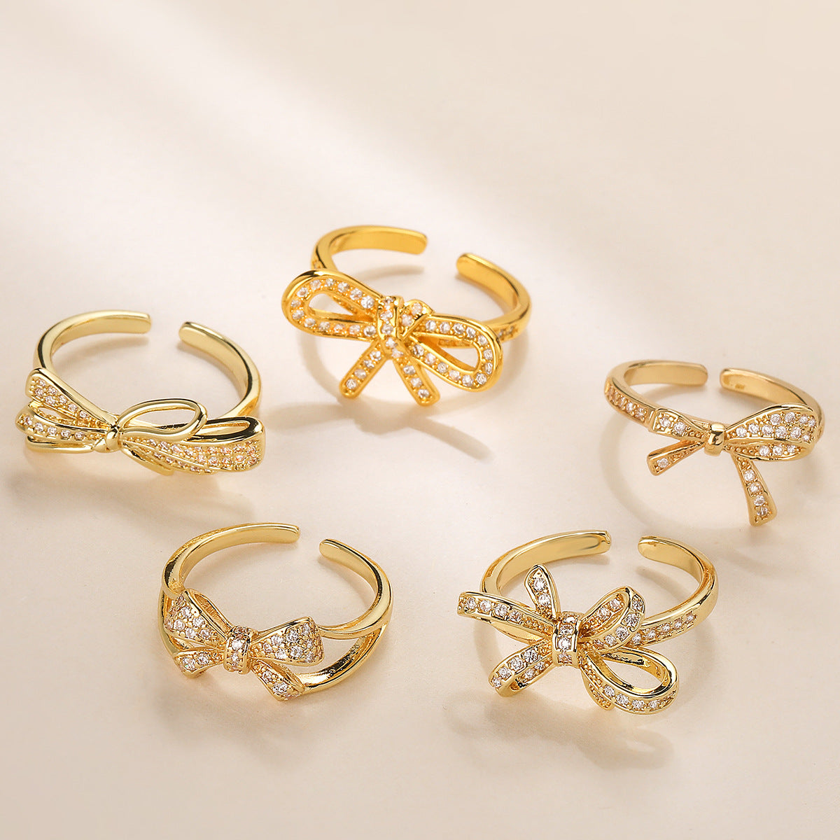 Geometric Bowknot-Shaped Opening Ring for Women in Copper with 18K Gold Plating and Cubic Zirconia Inlay