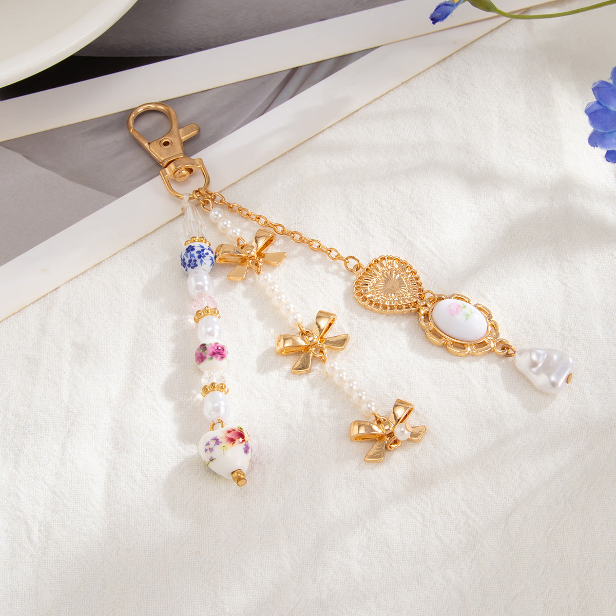 Minimalist Zinc Alloy Heart Pendant with Ceramic Pearl and Tassel Keychain Bag Charm