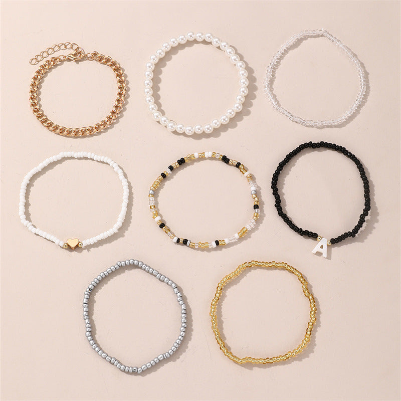Set di Braccialetti con Lettere in Perle di Vetro a Cuore Minimalista per Bambini con Perle in Resina e Lavorazione Artigianale