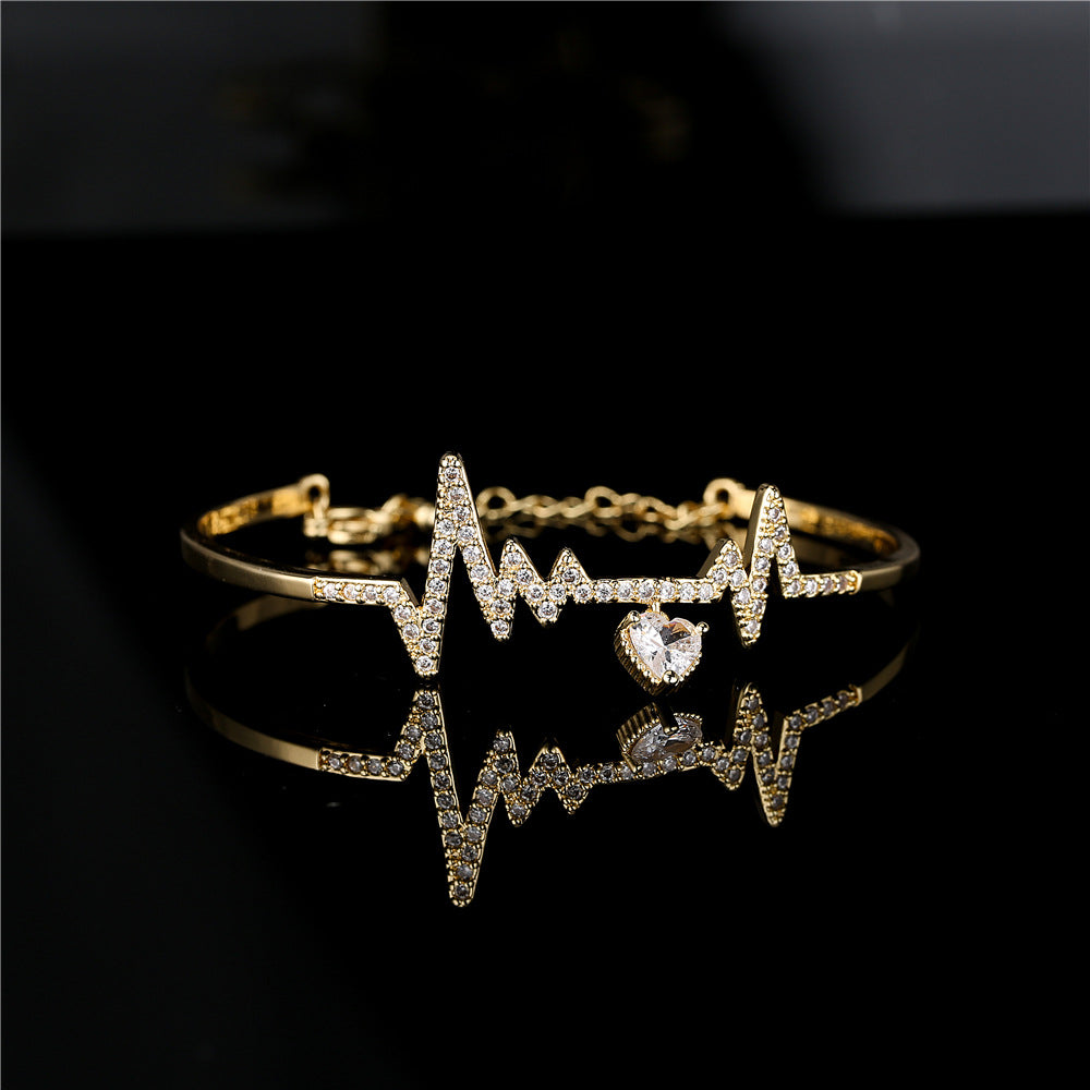 Gold Plated Brass Heartbeat Bracelet with Cubic Zirconia Inlay